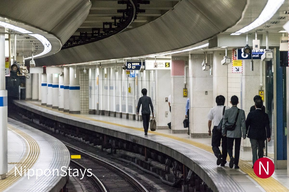 Trains and traffic crossing at Shinjuku Station