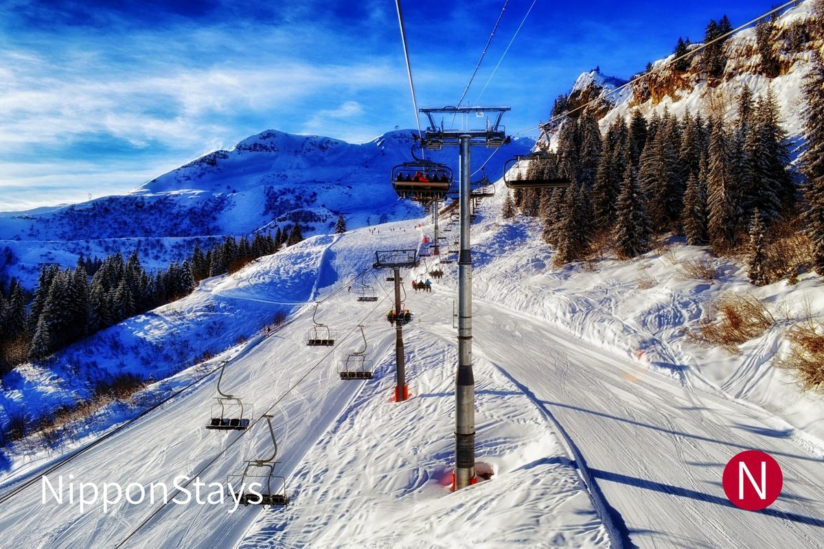 A chairlift crossing a snow-covered slope