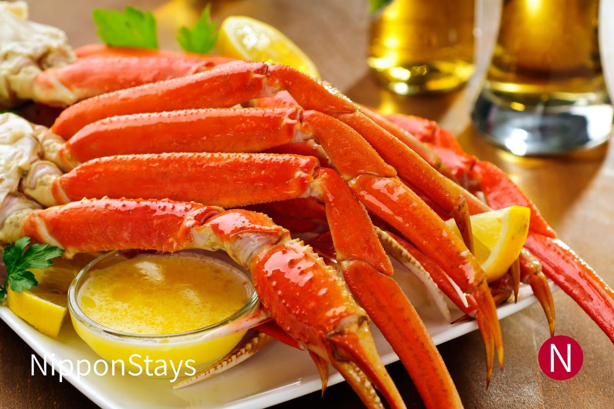 Snow crab legs cracked open and served on a platter