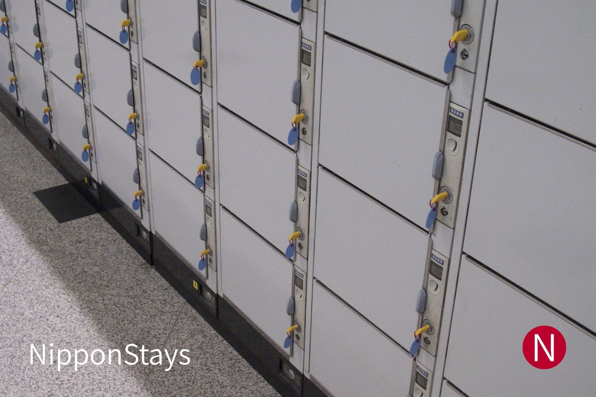 A bank of coin lockers with yellow keys in a Japanese station