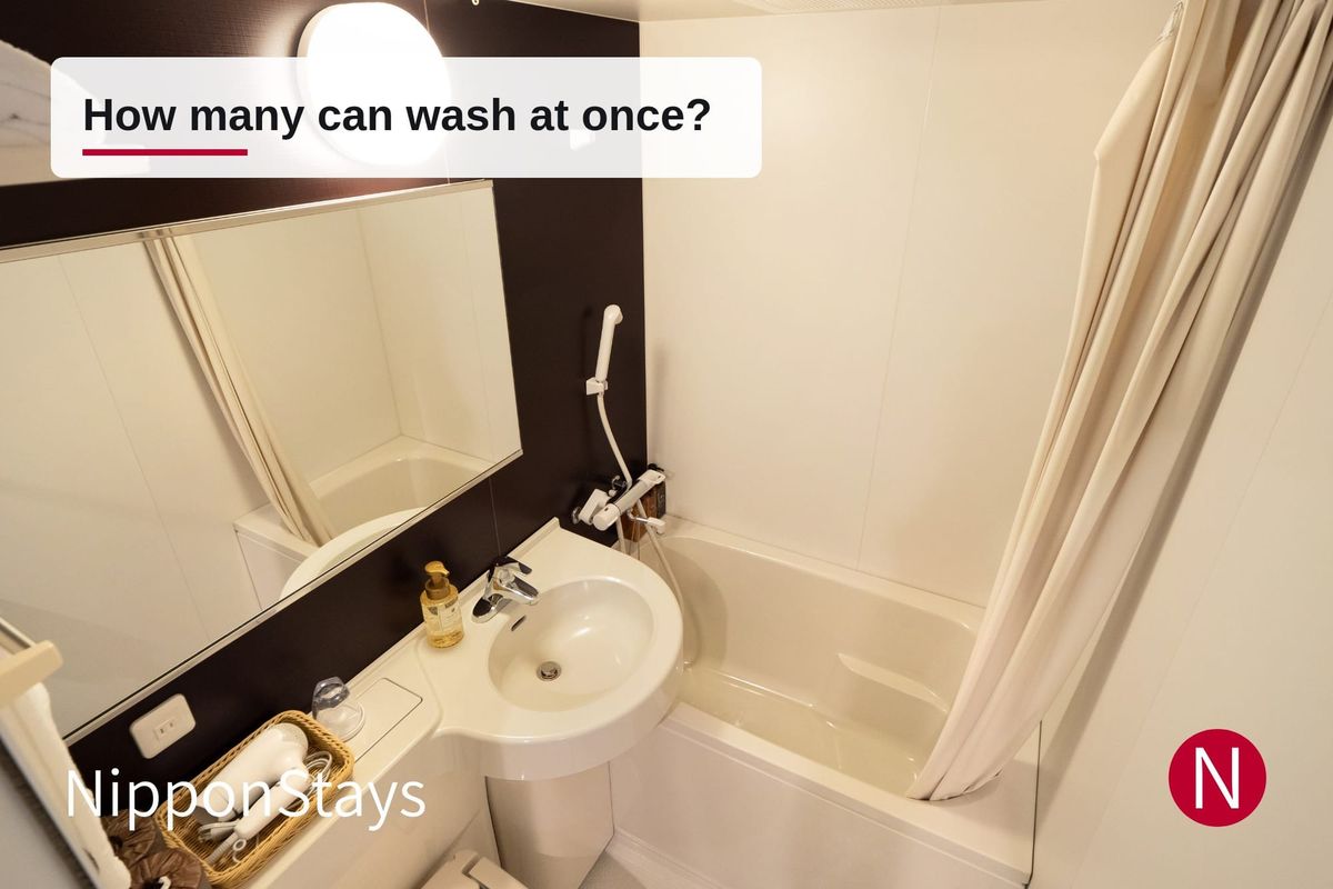 A Japanese three-piece unit bath with the tub, basin and toilet moulded into one small room