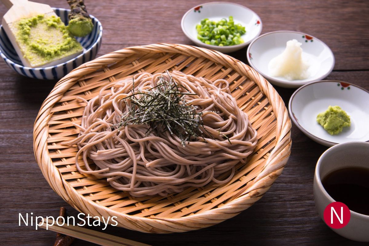 Cold zaru soba on a bamboo tray with wasabi, grated daikon and dipping sauce