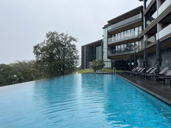 Infinity pool and hillside exterior of ANA InterContinental Beppu Resort and Spa
