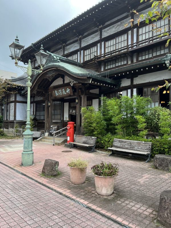 Wooden facade of Takegawara Onsen bathhouse in Beppu