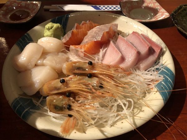 A platter of Hokkaido sashimi with scallops, salmon, shrimp and yellowtail