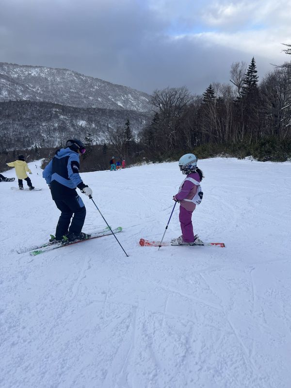 Instructor and young skier during a lesson at Kiroro