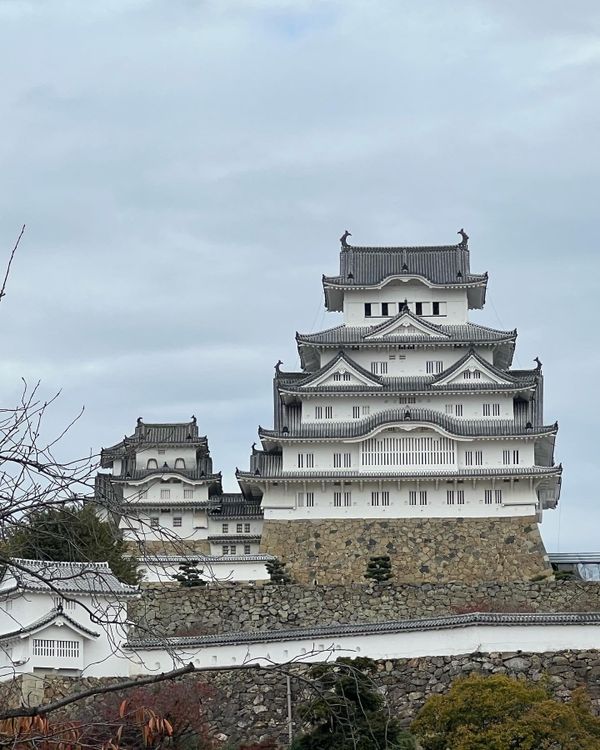Himeji Castle, a white multi-tiered Japanese castle rising above stone walls in Hyogo Prefecture
