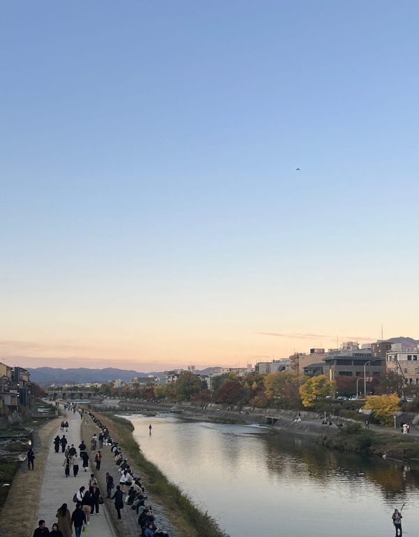 Kamo River banks at dusk in downtown Kyoto, near Kawaramachi