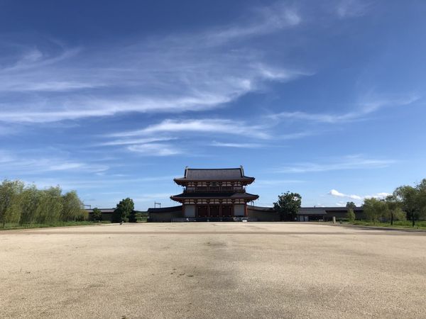 Reconstructed palace gate in Nara beneath a wide blue sky