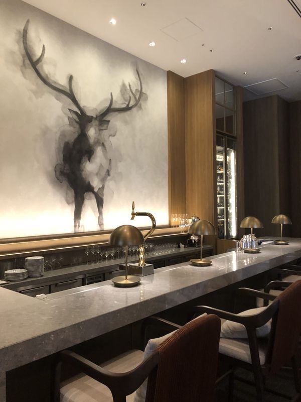 Hotel lounge in Nara with a deer artwork above the counter