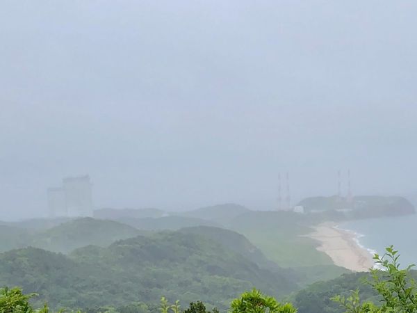 Tanegashima Space Center launch complex and coastline seen from a viewpoint in heavy fog