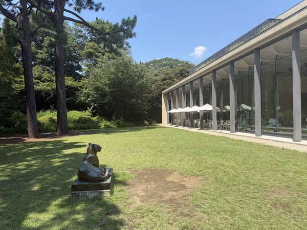 Lawn garden and glass-walled cafe annex at the Tokyo Metropolitan Teien Art Museum in Meguro