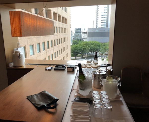 A hotel lounge with a Tokyo cityscape view