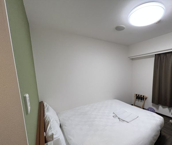 Double room at Kumamoto Tokyu REI Hotel with a compact bed and desk