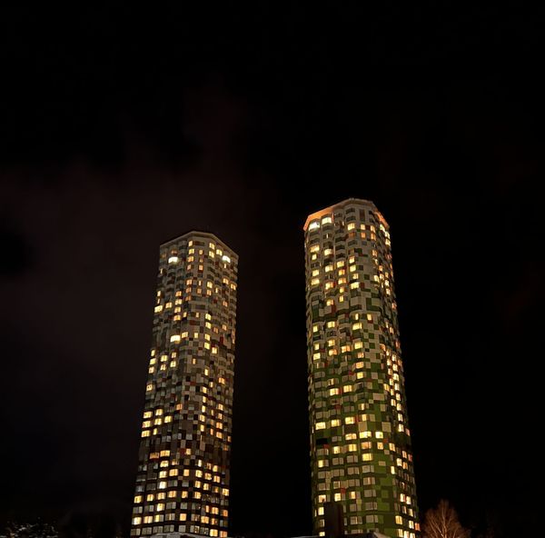 The Tower at Hoshino Resorts Tomamu lit up at night in midwinter