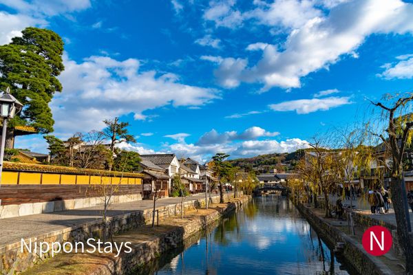 The canal and white-walled storehouses of Kurashiki's Bikan quarter