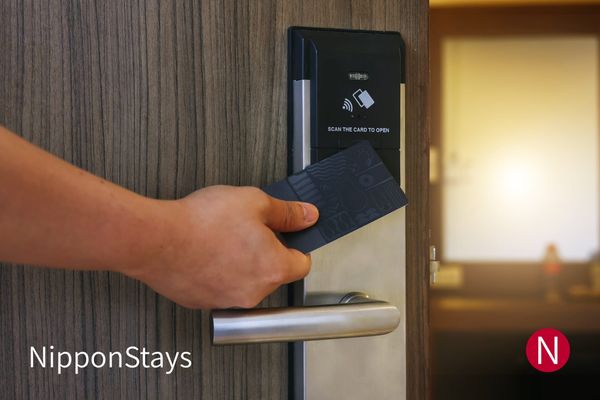 An electronic key-card lock on a hotel room door