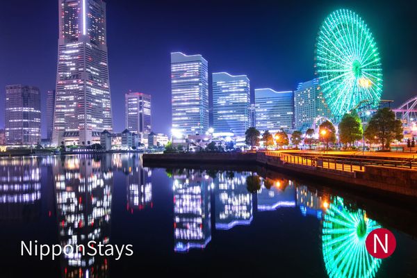 Minato Mirai in Yokohama at night, the ferris wheel reflected in the water