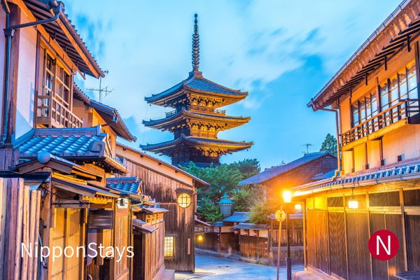 Yasaka Pagoda above Kyoto rooftops at dusk