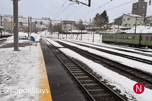 Snow-covered tracks at a Japanese station