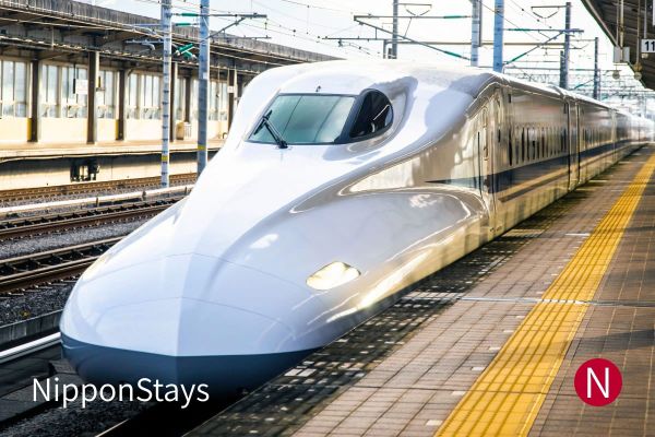 A shinkansen waiting at a platform in Japan