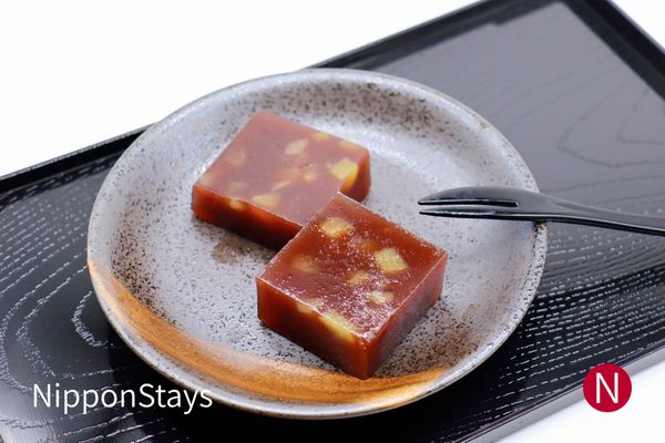 Slices of chestnut yokan on a ceramic plate