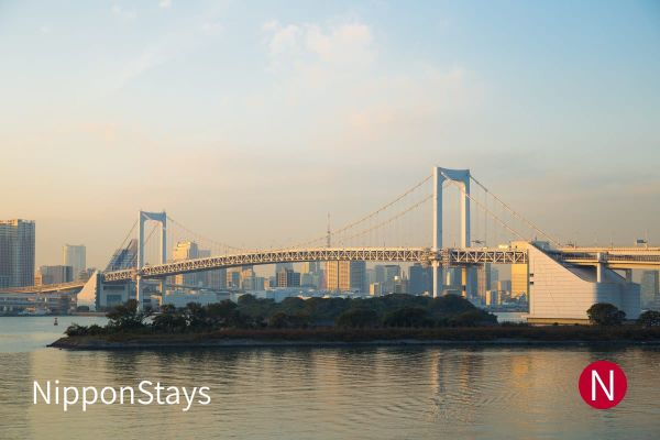 The Rainbow Bridge and the Tokyo skyline at dusk