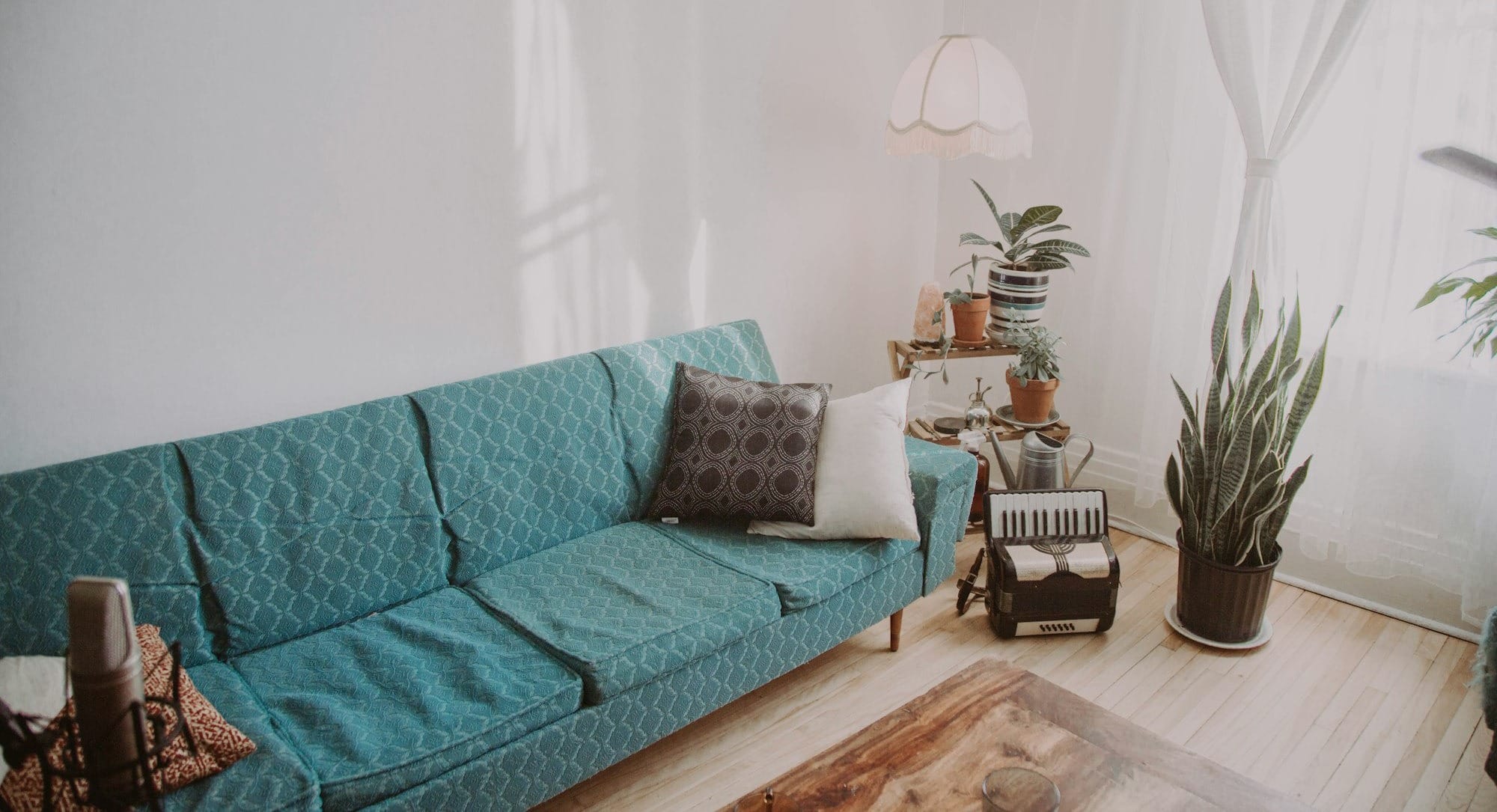 sofa beside accordion on floor