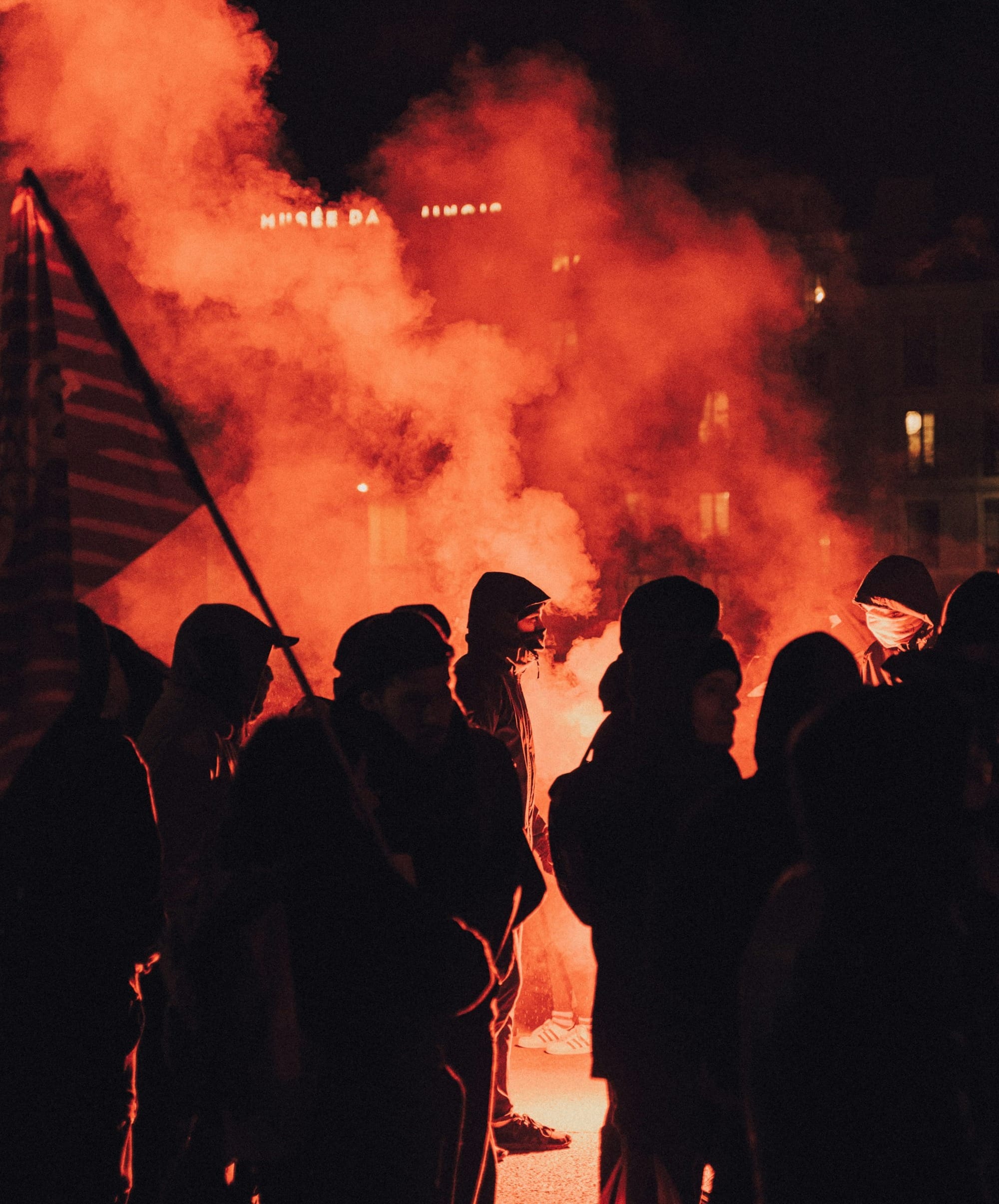 people standing on snow covered ground during night time