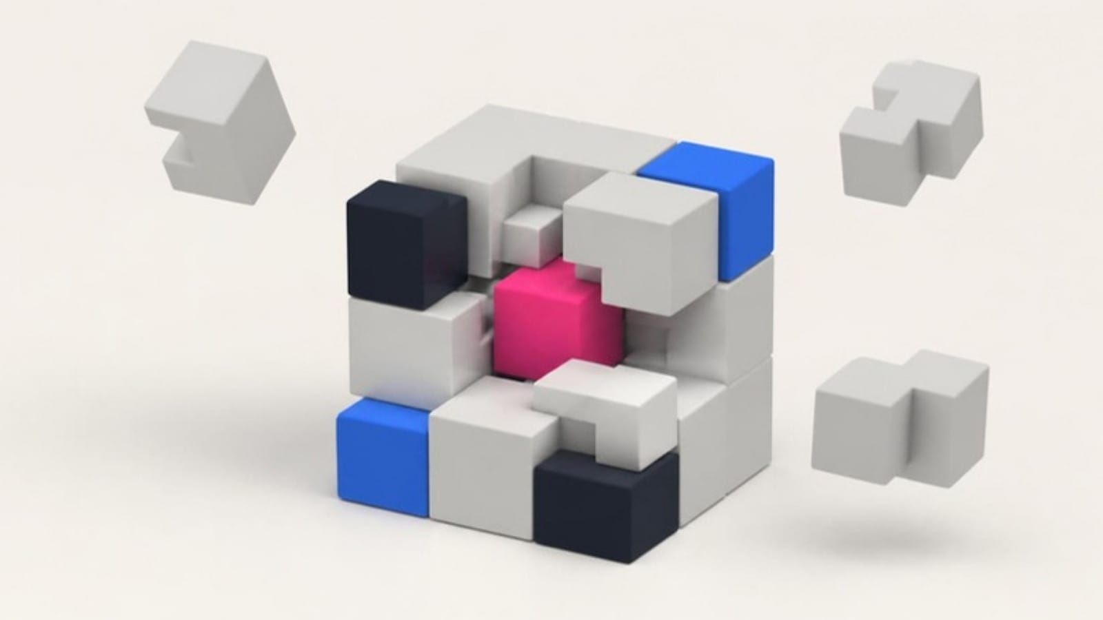 A pink cube at the center of a larger block of grey and blue modules, some pieces floating free.