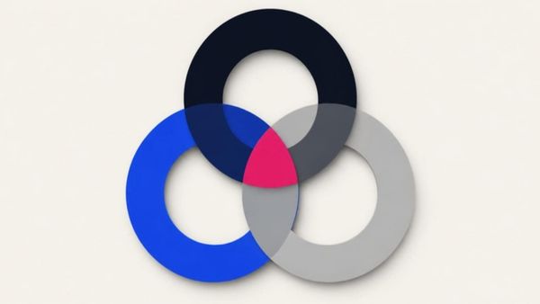 Three overlapping rings in navy, blue and grey, with the shared center filled in pink.
