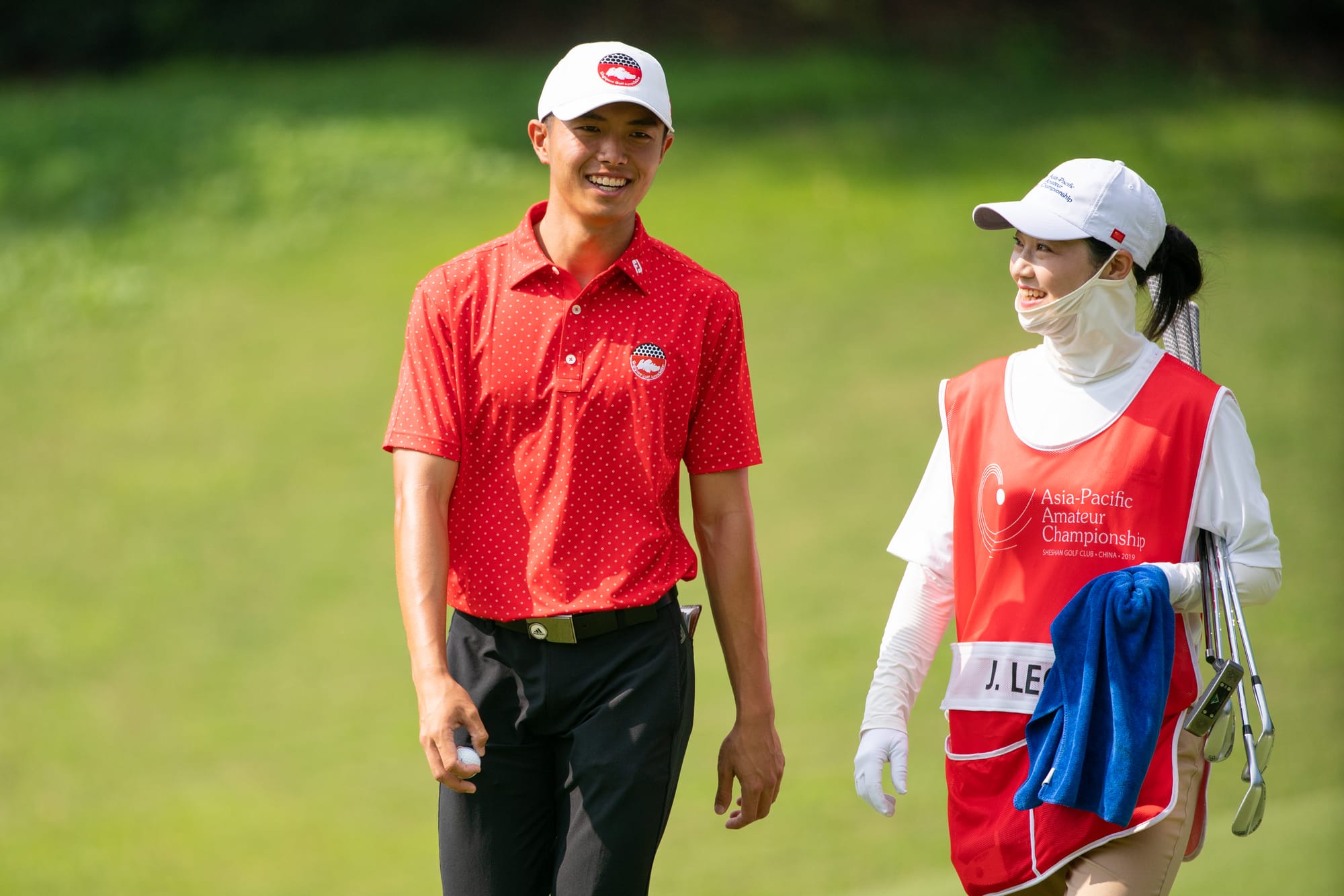 James Leow shares a light-hearted moment with his caddie. His equal fifth place finish was the best performance by a Singaporean in Asia-Pacific Amateur Championship history.  
