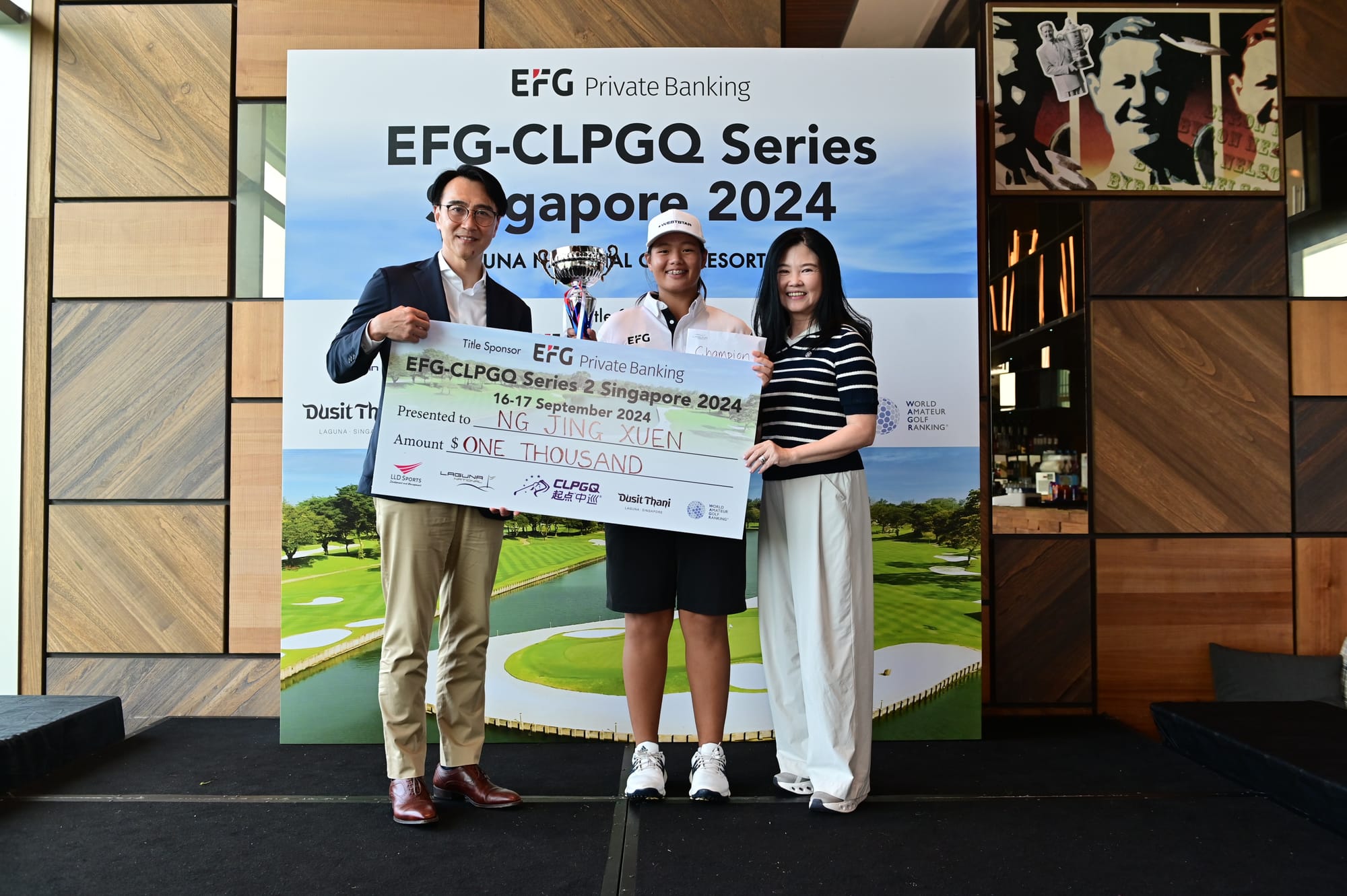 Ng Jing Xuen is congratulated on her victory by Albert Chiu and Lyn Yeo. Picture by LLD Sports.