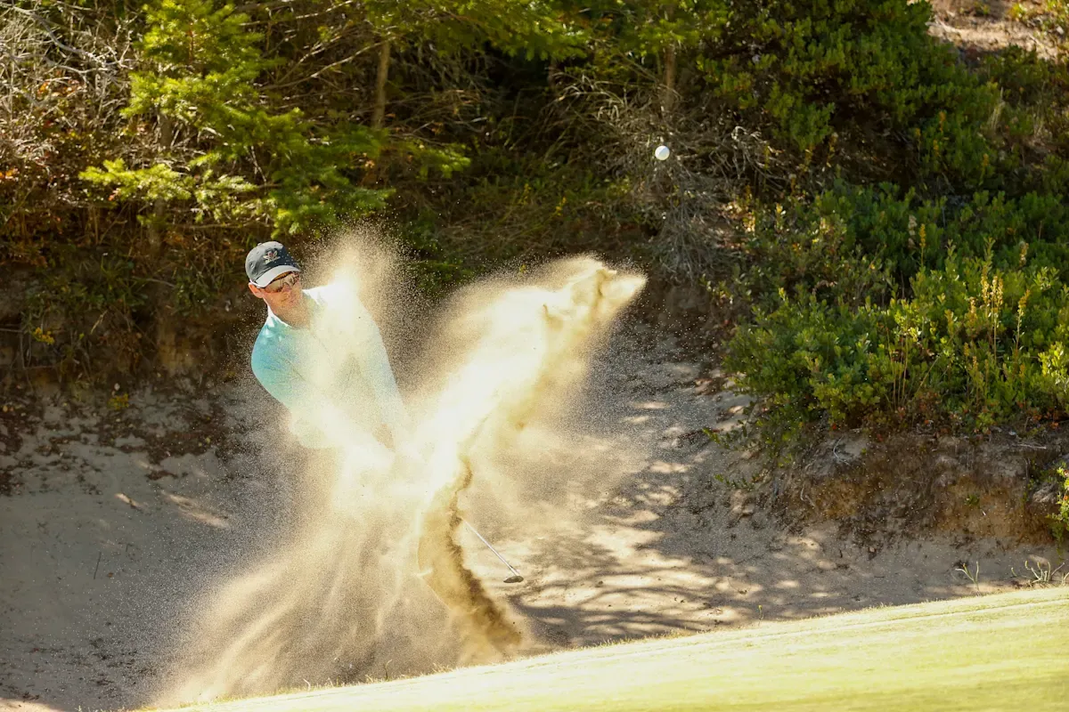 Australian Lukas Micel blasting out of a sand trap at Bandon Dunes. Picture by  Steven Gibbons/USGA.