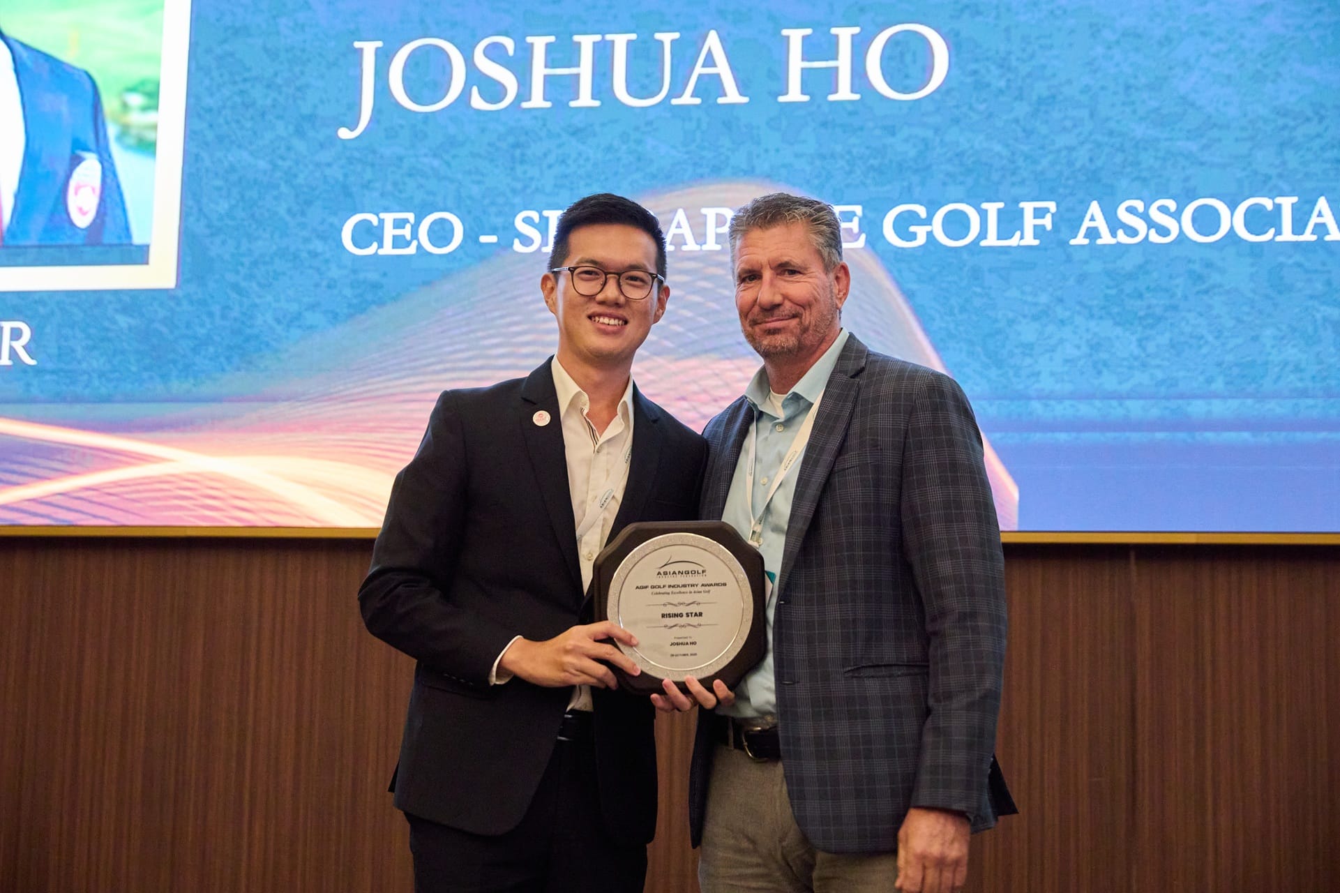 Joshua Ho receives his award from AGIF Treasurer Mark Donohue.  
