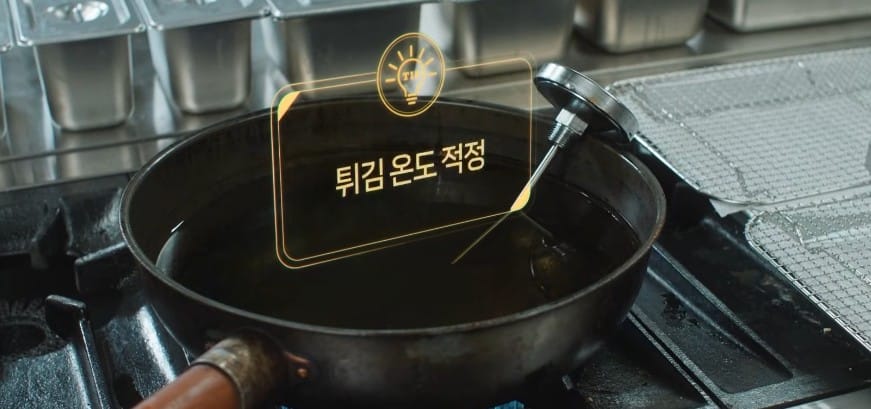 Korean military drama scene showing the main character cooking in an army kitchen with AI assistance