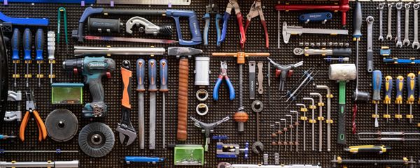 A wall of various tools, all lined up and waiting to be used again.