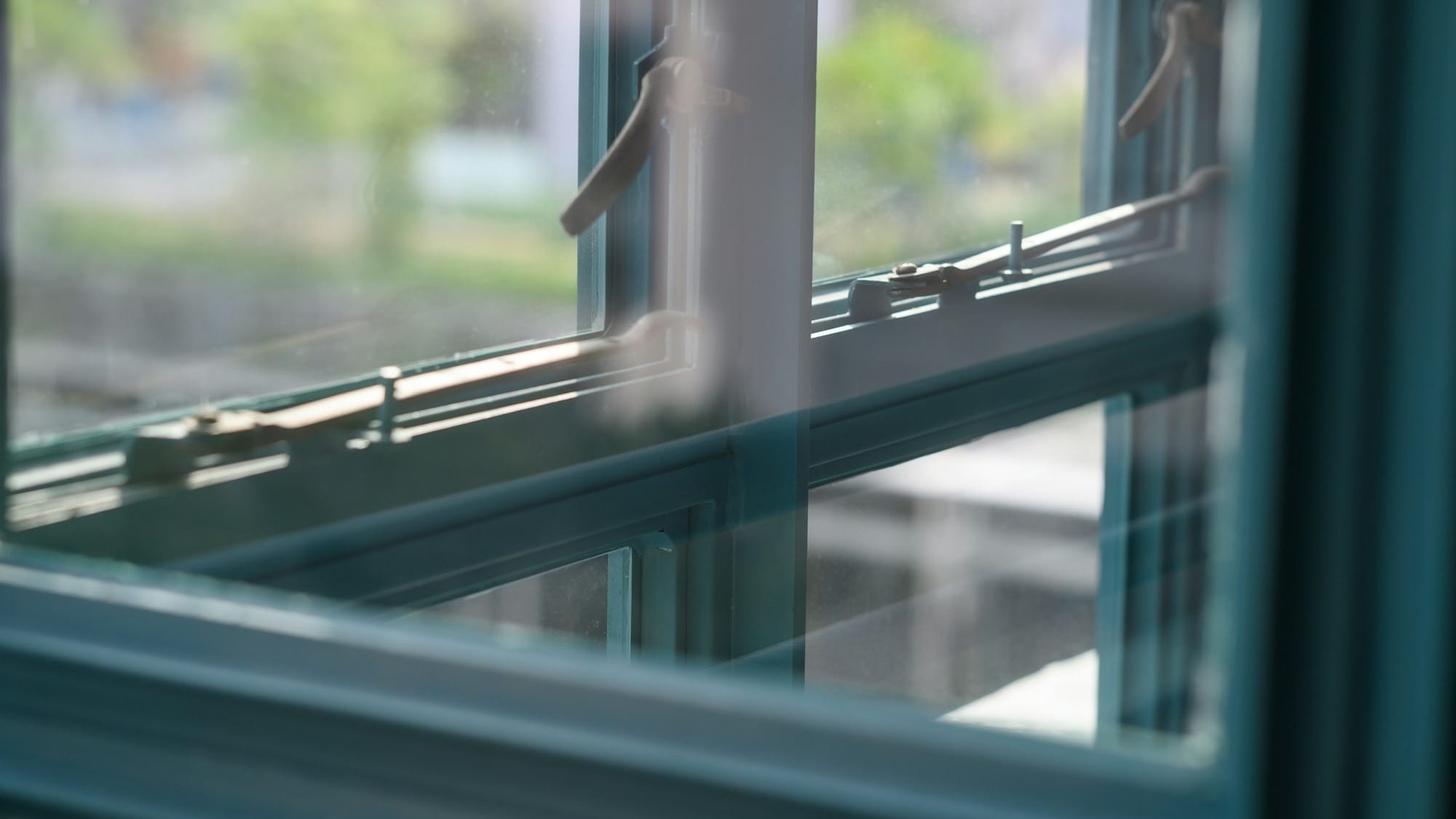 grey metal framed glass window closed