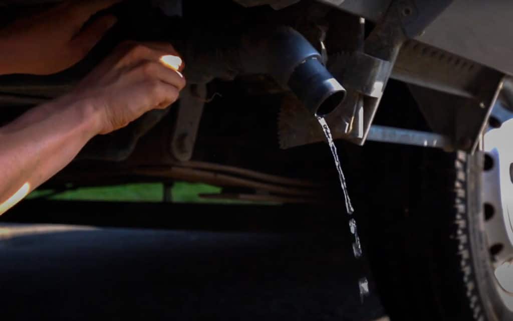 Grey water draining from a motorhome into the drain at a service point