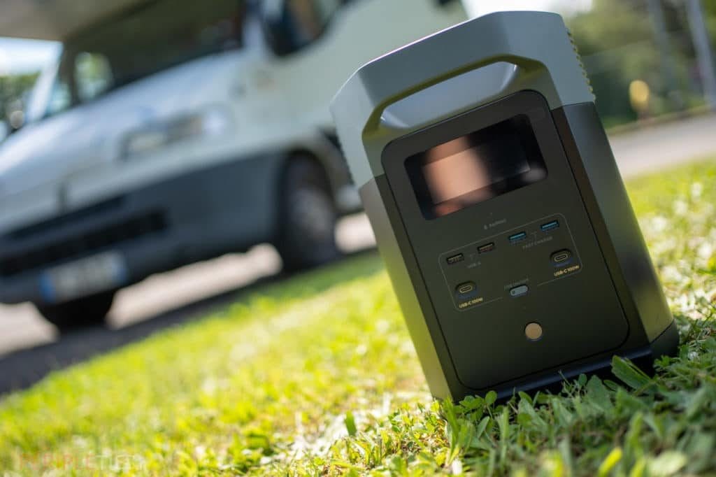 EcoFlow Delta 2 portable power station on the grass next to a motorhome