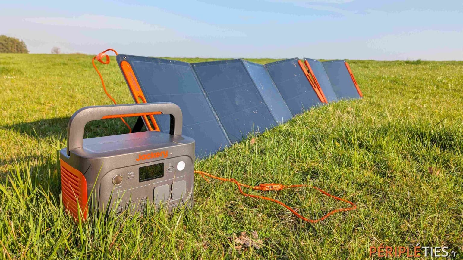 The SolarSaga panel unfolded in full sun, with the battery next to it