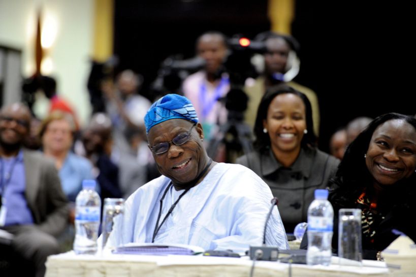 Former President of Nigeria, Olusegun Obasanjo and his daughter, Enitan Obasanjo share a light moment during the session. Beh
