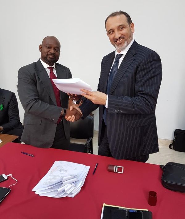 Osam Iyahen, Vice President of Investments and Natural Resources at AFC and Mohamed Toumi, CEO of Topic during the signing of