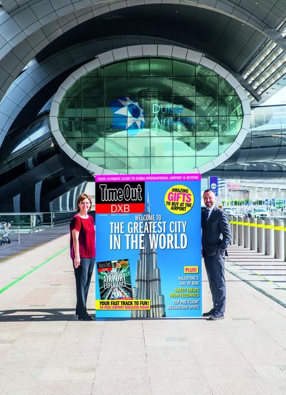 Sue Holt, Executive Director ITP Media Group and Eugene Barry, EVP Commercial at Dubai Airports with a larger than life Time 