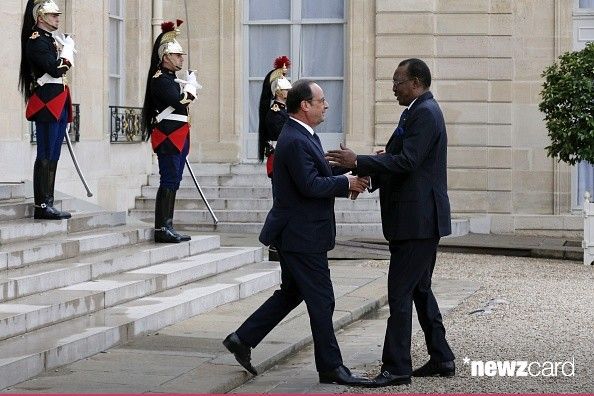 French President Francois Hollande (L) greets Chadian President Idriss Deby Itno as he arrives for a meeting at the Elysee Pa