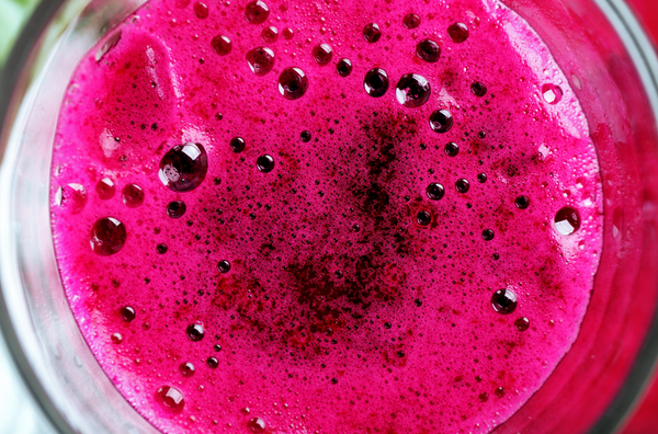 A close-up image of beet juice in a thick glass cup | The Reframery | Death Doula, Humanist, and Community Organizing Perspectives