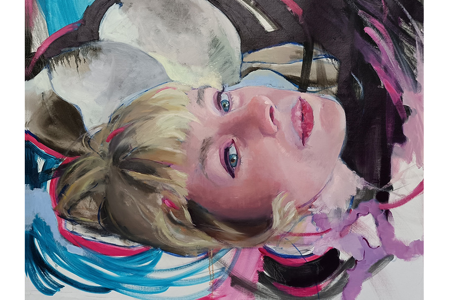 A painted self-portrait of a blonde woman lying on her back, surrounded by loose strokes of blue, pink and dark purple.