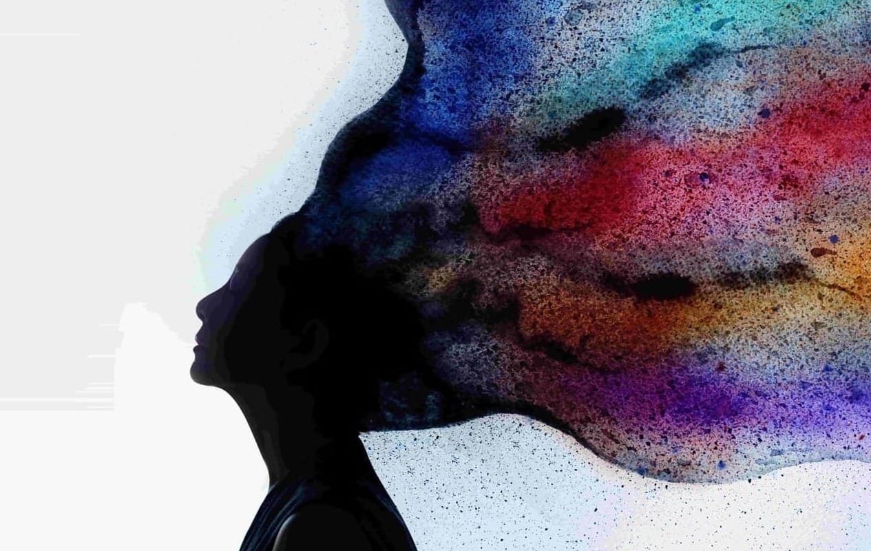 Silhouette of a woman in profile, eyes closed, her hair dissolving into a wide sweep of watercolour in blue, turquoise, red, gold and violet.