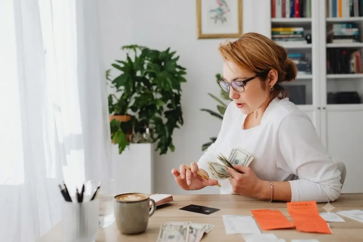Woman calculating bills and credit card debt 