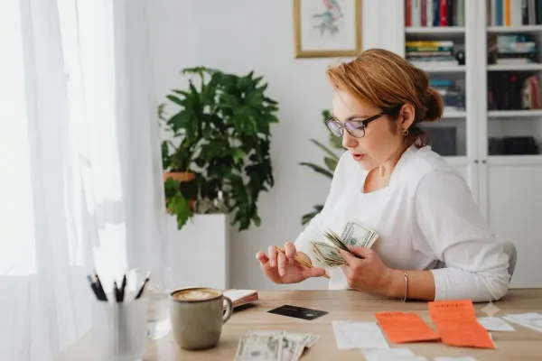 Woman calculating bills and credit card debt 